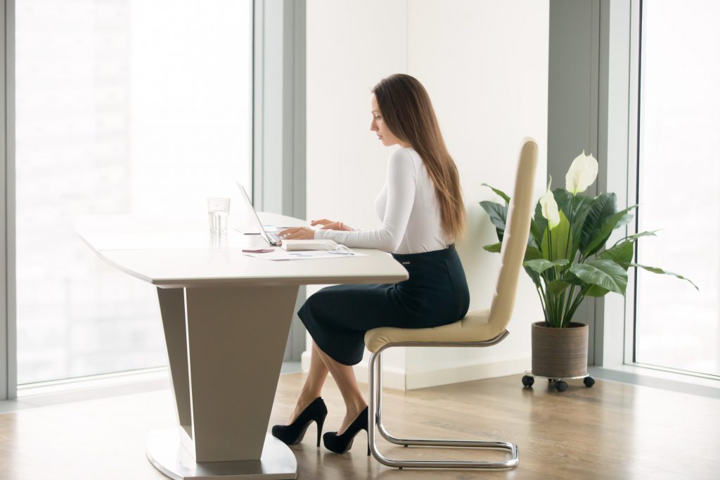 Young woman working at the office desk